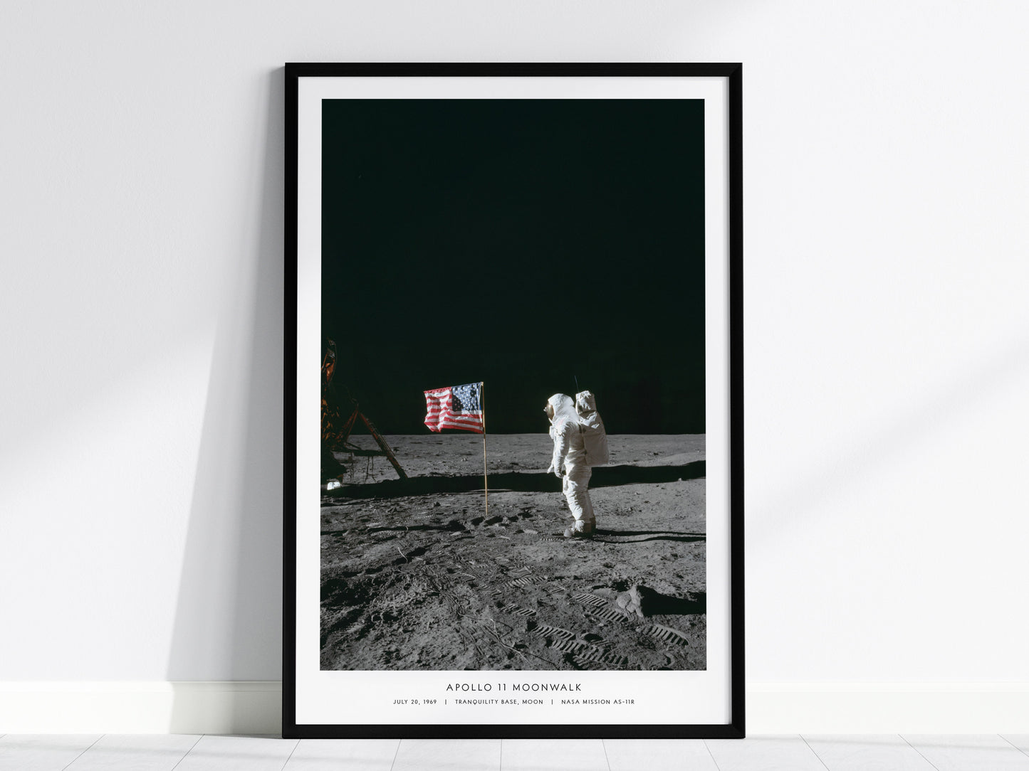 Apollo 11 moonwalk poster with Buzz Aldrin standing beside the American flag on the lunar surface