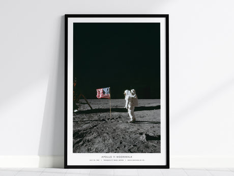 Apollo 11 moonwalk poster with Buzz Aldrin standing beside the American flag on the lunar surface