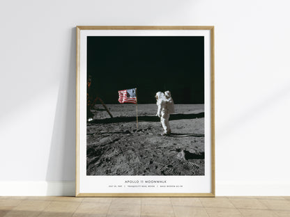 Natural wood frame Apollo 11 Buzz Aldrin on the Moon wall art leaning against white wall