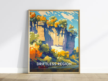 Framed poster of a scenic landscape with 'Driftless Region' text on a white wall.