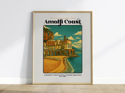Framed Amalfi Coast Italy travel poster hanging above a sofa in a modern living room