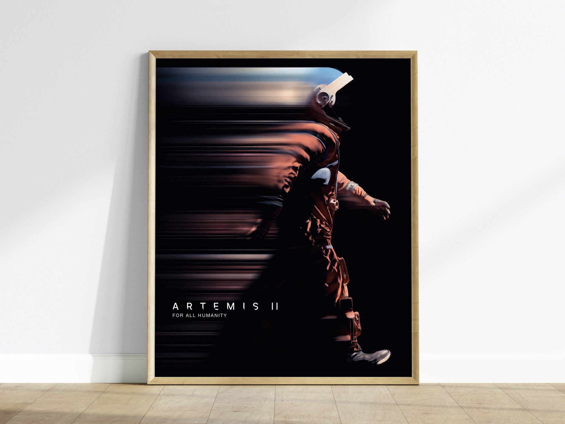 Framed Artemis II mission poster hanging on a white wall in a modern living room