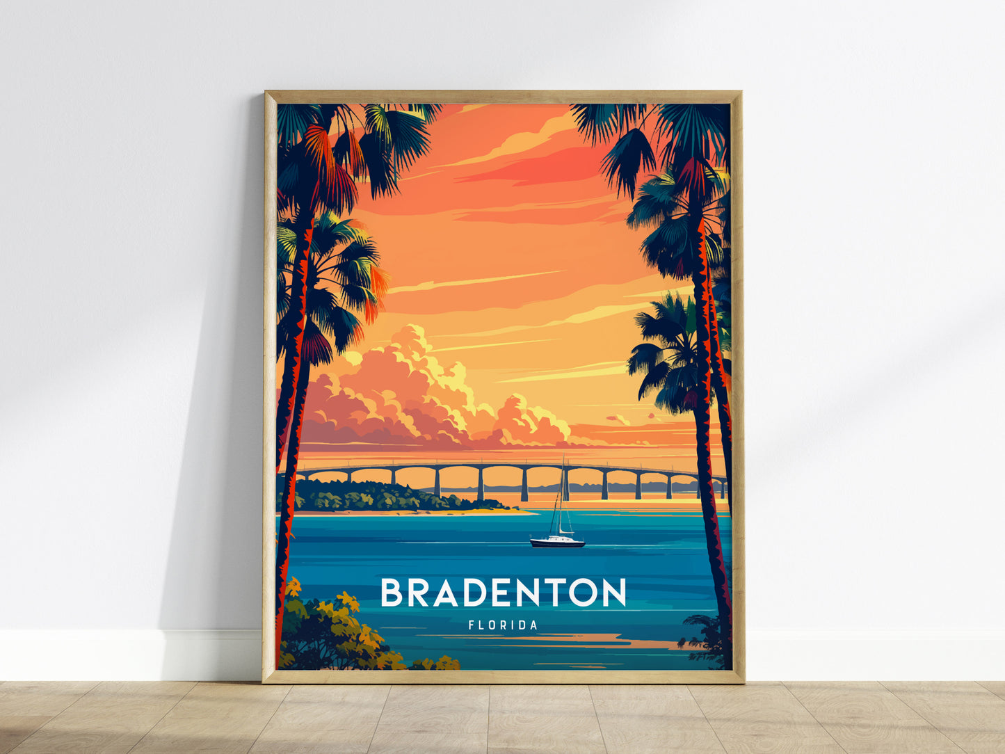 Framed artwork of Bradenton, Florida with palm trees and a bridge over water.