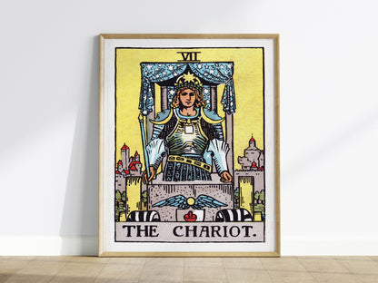 Framed tarot card print titled 'The Chariot' on a white wall.