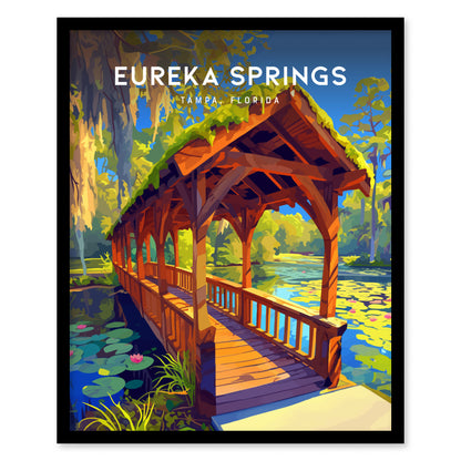 A vibrant illustration of a covered wooden bridge over a serene stream, surrounded by lush greenery and water lilies, with the text Eureka Springs, Tampa Florida at the top.