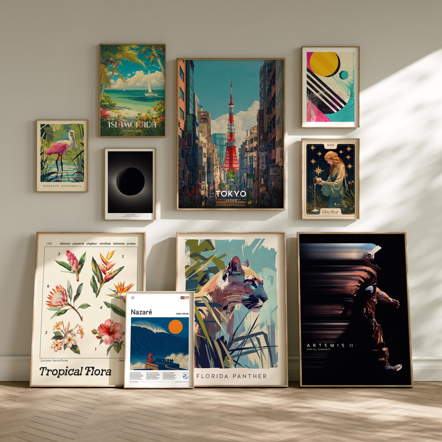 A stylish gallery wall displays various framed art prints, featuring vibrant designs such as a Florida panther, tropical flora, and a Tokyo cityscape.