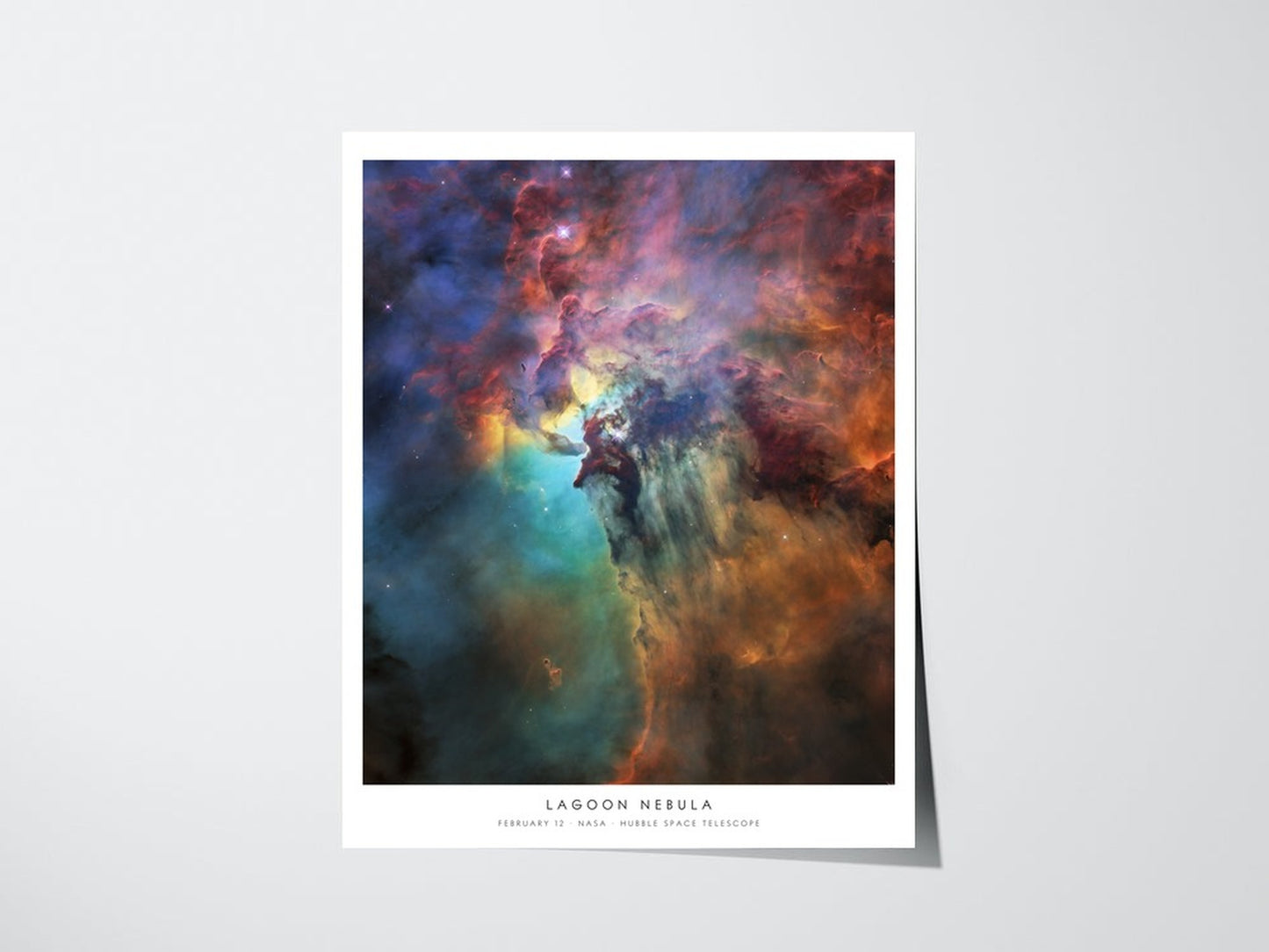 Personalized Hubble birthday print showing Lagoon Nebula for February 12, unframed giclee poster with caption on a light wall