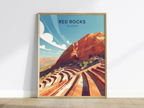 This image shows a framed poster of Red Rocks Amphitheatre featuring a modern illustration with vibrant colors.