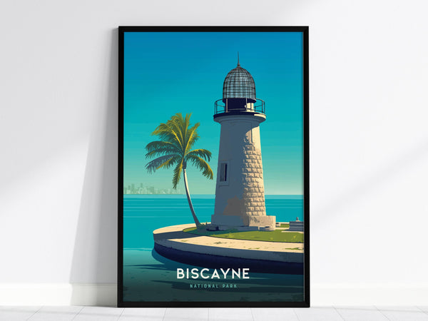 A framed art print depicts a lighthouse with a palm tree on a sunny day at Biscayne National Park. The scene features a bright blue sky and calm ocean waters, with a city skyline faintly visible in the distance.
