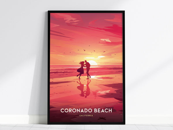 A framed poster depicting a romantic scene at Coronado Beach, California, shows a couple dancing on the shoreline during a vibrant sunset. The warm colors and silhouettes create a serene coastal atmosphere.