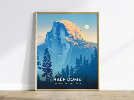 A framed poster depicting Half Dome in Yosemite National Park, showcasing a stylized illustration with blue and golden hues. The foreground features silhouetted trees, and the title Half Dome Yosemite National Park is visible at the bottom.