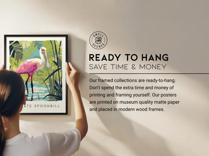 Person hanging a framed poster of a pink bird with text about ready-to-hang framed collections.