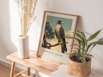Framed artwork of a Peregrine Falcon on a wooden side table with plants and a vase.