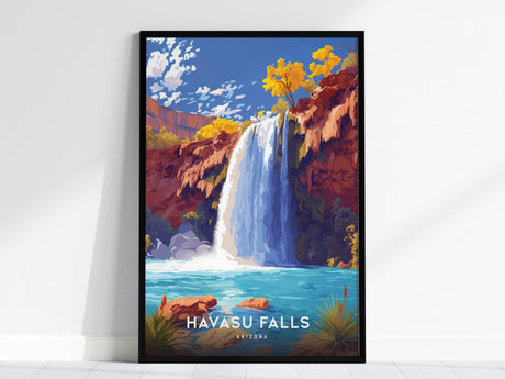 A framed poster of Havasu Falls is displayed against a white wall, featuring vibrant turquoise waters cascading down red cliffs with colorful foliage. Perfect for nature-inspired wall art.