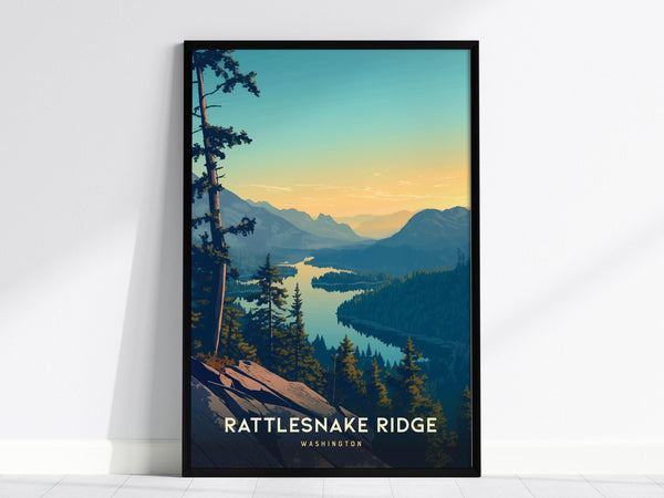Framed poster depicting a scenic view of Rattlesnake Ridge in Washington, showcasing a sunset over lush forests and winding waterways. Tall pine trees frame the foreground, with mountains silhouetted against the colorful sky.