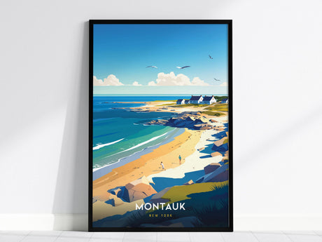 A framed poster depicts a scenic coastal view with a sandy beach, rocky shoreline, and a few small houses in the distance under a clear blue sky. Birds fly above, and the word Montauk is prominently displayed at the bottom.