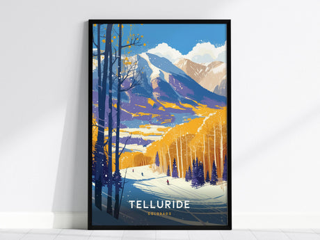 A framed poster features a colorful vintage-style illustration of Telluride, Colorado, showcasing snow-covered mountains, golden aspen trees, and skiers on a snowy slope. The word Telluride is prominently displayed at the bottom.