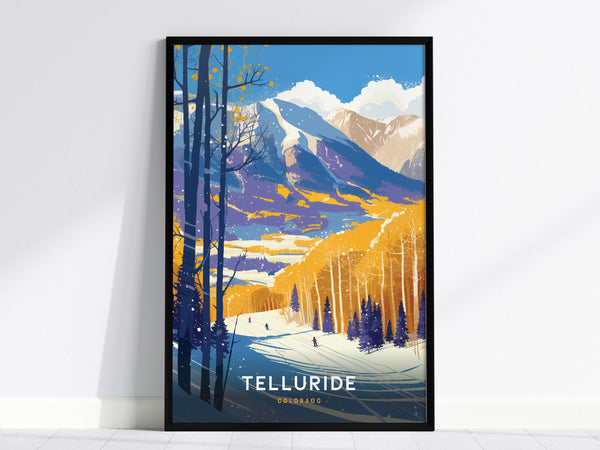 A framed poster features a colorful vintage-style illustration of Telluride, Colorado, showcasing snow-covered mountains, golden aspen trees, and skiers on a snowy slope. The word Telluride is prominently displayed at the bottom.