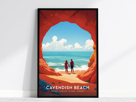 A framed poster features an illustration of a couple holding hands, standing in a rocky archway overlooking a serene ocean view with blue skies and clouds. The text reads Cavendish Beach, Prince Edward Island, Canada.