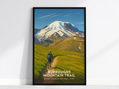 A framed poster of a hiker on a winding trail through lush green meadows, leading toward the snow-capped Mount Rainier under a clear blue sky. The wall art captures the scenic beauty of Burroughs Mountain Trail.