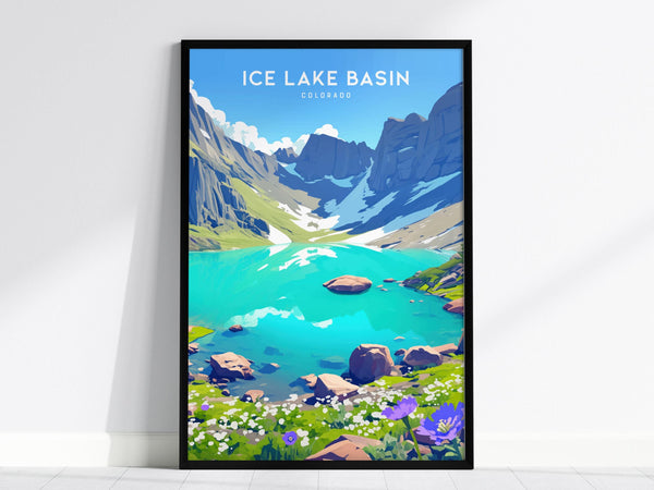 A framed poster of Ice Lake Basin in Colorado, showcasing vibrant turquoise alpine water surrounded by rugged peaks and lush meadows with wildflowers. The scene is set against a bright blue sky.