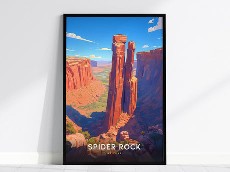The image shows a framed poster of Spider Rock in Arizona, featuring a vibrant depiction of the sandstone spire rising from the red canyon floor under a bright blue sky. Bold text at the bottom reads SPIDER ROCK ARIZONA.