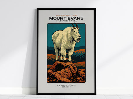 A framed poster featuring a stylized illustration of a mountain goat standing on rocky terrain with a mountainous backdrop. The text reads Mount Evans Wilderness Area, adding a striking touch to any wall art collection.