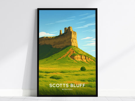 A framed poster depicting Scotts Bluff National Monument with a towering bluff and lush green landscape under a bright blue sky. The text Scotts Bluff Nebraska is prominently displayed at the bottom.