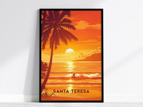 A vibrant poster of Santa Teresa, Costa Rica, showing a lone surfer riding waves under a glowing sunset. Palm trees frame the scene, set against an orange and yellow sky, capturing a tropical beach vibe.