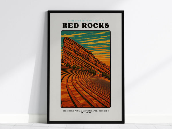 Framed poster of Red Rocks Amphitheatre featuring a vintage block print design. The artwork showcases curved seating against vibrant orange and blue skies, with bold typography and Red Rocks prominently displayed at the top.