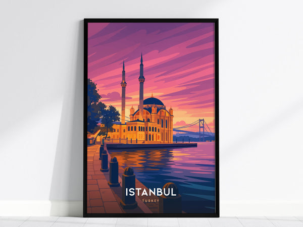 A framed poster displays a vibrant illustration of the Ortakoy Mosque against a colorful sunset, with the Bosphorus Bridge in the background. The scene is reflected in the water, creating a serene and picturesque view.
