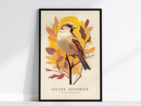 A framed poster of a house sparrow perched on a branch is displayed against a white wall. The artwork features warm shades of gold and beige, with stylized leaves in the background and the text House Sparrow (Passer domesticus) below.