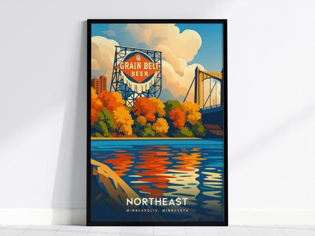 A framed poster depicts the iconic Grain Belt Beer sign against a backdrop of colorful fall trees and a bridge, reflecting in the Mississippi River. The words Northeast Minneapolis are printed at the bottom.
