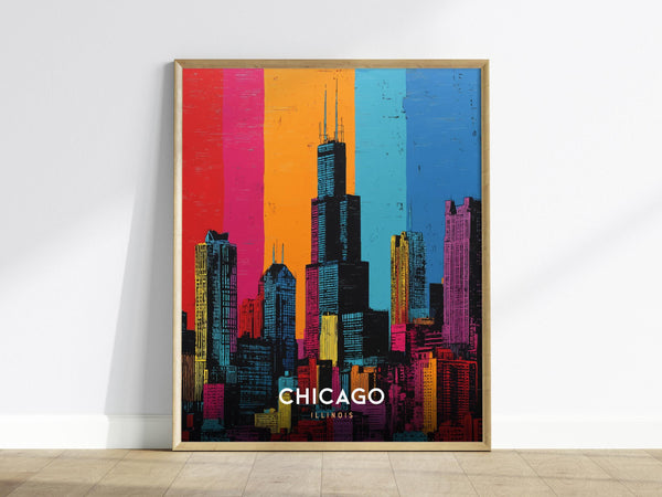 A framed pop art poster of the Chicago skyline in vibrant colors, featuring the iconic Willis Tower. The background is divided into vertical bands of red, orange, blue, and pink, enhancing the cityscapes modern and artistic appeal.