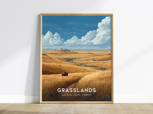 Framed poster depicting Grasslands National Park in Canada, featuring golden hills under a blue sky with fluffy clouds and a solitary bison in the foreground. The artwork captures the vast prairie landscape.