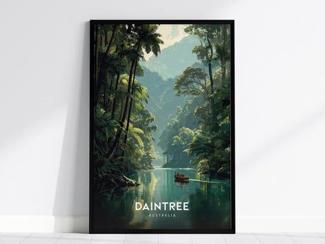 A framed poster depicting a serene scene of the Daintree Rainforest, featuring a tranquil river lined with lush tropical trees and a small boat. The word DAINTREE and AUSTRALIA are printed at the bottom.