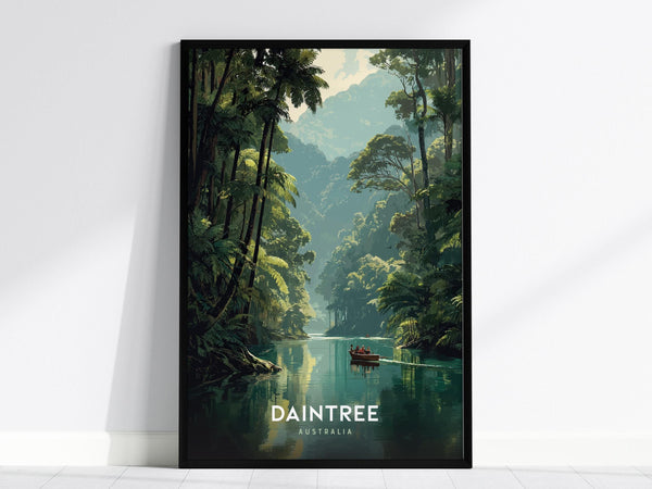 A framed poster depicting a serene scene of the Daintree Rainforest, featuring a tranquil river lined with lush tropical trees and a small boat. The word DAINTREE and AUSTRALIA are printed at the bottom.