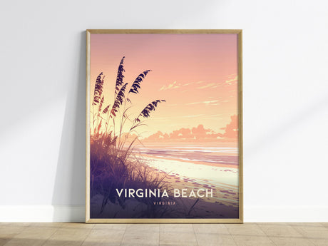 A framed poster depicting a serene Virginia Beach sunset with soft pink and orange hues over the ocean. Tall grasses silhouette the foreground, adding depth to the tranquil coastal scene.