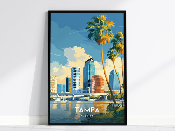 A framed poster of Tampa, Florida, features a vibrant illustration of the citys skyline with towering palm trees in the foreground. The scene captures reflections of high-rises in the water under a bright, blue sky.