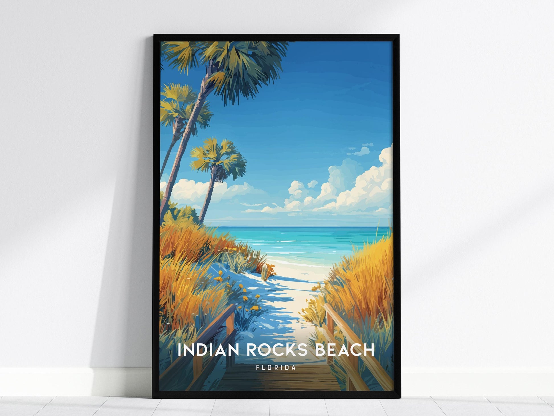 Interior view showing framed and unframed wall art depicting a serene boardwalk and turquoise waters of Indian Rocks Beach.