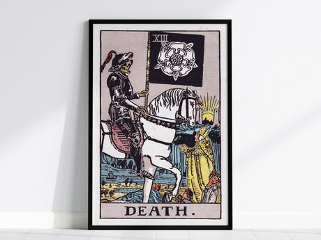 Interior view showing framed and unframed wall art depicting the transformative symbolism of the Death tarot card.