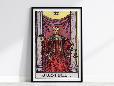 The image shows a framed Justice tarot card poster featuring the classic Rider-Waite-Smith illustration. A figure in a red robe sits between stone pillars, holding a sword and scales, embodying balance and fairness.