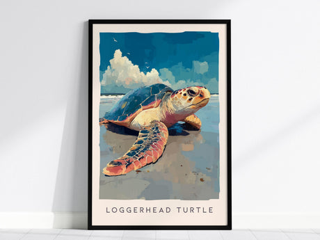 A framed poster illustrating a loggerhead sea turtle resting on a beach, with a vibrant blue sky and fluffy clouds in the background. The turtles detailed shell and scales are highlighted, capturing its natural beauty.