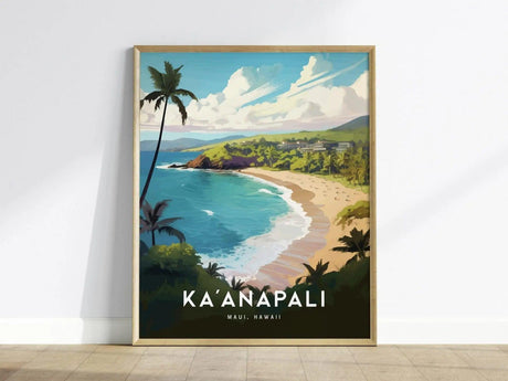 Framed poster of Kaanapali Beach in Maui, Hawaii, featuring a vibrant illustration of golden sand, clear blue water, and lush greenery with palm trees. The poster leans against a white wall on a wooden floor.
