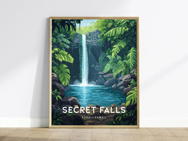A framed poster depicting a waterfall cascading into a clear pool, surrounded by lush green tropical foliage and rocks. The text SECRET FALLS KAUAI HAWAII is at the bottom.