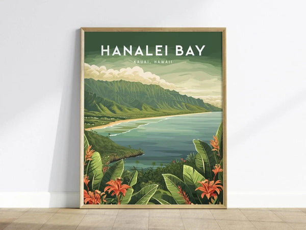 Framed artwork of Hanalei Bay, Kauai, Hawaii, showcasing a scenic view of lush mountains, a serene bay, and tropical foliage with orange flowers in the foreground. The poster leans against a white wall on a wooden floor.