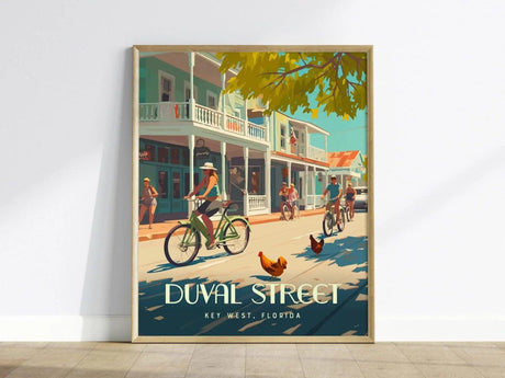 A vibrant poster of Duval Street in Key West depicts cyclists, pedestrians, and roosters under sunny skies, framed against colorful buildings. Text reads Duval Street, Key West, Florida.