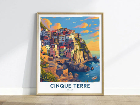 A vibrant illustration of the Cinque Terre coastline features colorful cliffside villages nestled among rocky cliffs, with boats in the sparkling blue sea below. The artwork captures the essence of Italys Ligurian coast, framed elegantly.