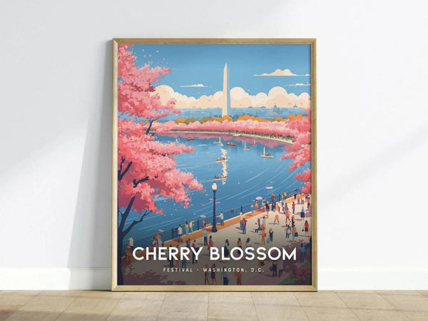 A framed poster depicting a vibrant scene of Washington D.C. during the Cherry Blossom Festival. Pink cherry blossoms frame a view of the Washington Monument across a river, with people strolling along the waterfront.