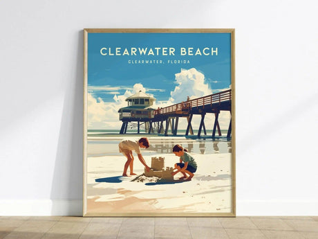 A vibrant poster depicting two children building a sandcastle on Clearwater Beach, with gentle waves in the background. The pier looms in the distance under a bright blue sky, capturing the essence of Floridas coastal charm.